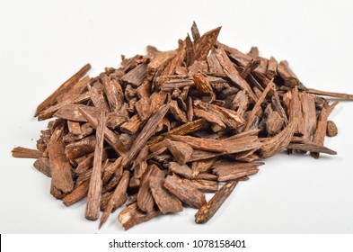 Selective Focus, Sticks Of Agar Wood Or Agarwood Background. The Incense Chips Used By Burning For Incense & Perfumes Of Essential Oil As Oud Or Bakhoor
