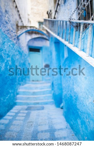 (Selective focus) Stunning view of a narrow alleyway with the striking, blue-washed buildings. Chefchaouen, or Chaouen, is a city in the Rif Mountains of northwest Morocco. Stock fotó © 