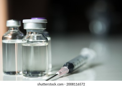 Selective Focus Of Syringe And Medicine In Vial , Ready For Vaccine Injection , Cancer Treatment , Pain Treatment And Can Also Be Abused For An Illegal Use, Healthcare And Medical Concept Vaccination.