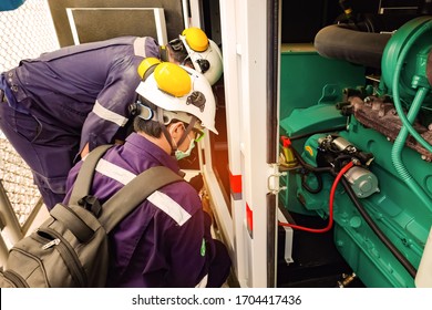 Selective focus of the technician is checking the condition of the battery by battery tester.