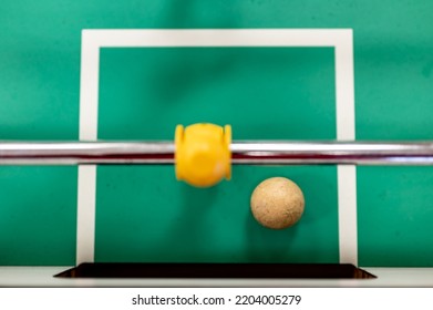 Selective Focus Top View On A Foosball Goalie Missing A Block In Front Of The Goal.