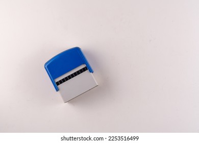 Selective focus top view of rubber stamp isolated on white background with empty text area. - Shutterstock ID 2253516499