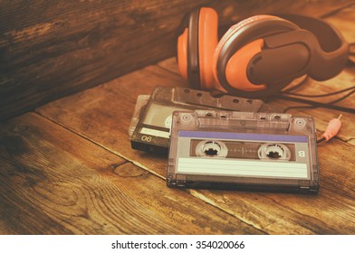 selective focus of top view of vintage headphones and cassettes
