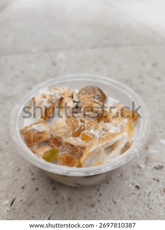 Selective focus Umm Ali ready to eat. Served in bowl. Homemade. Arabian dessert. 