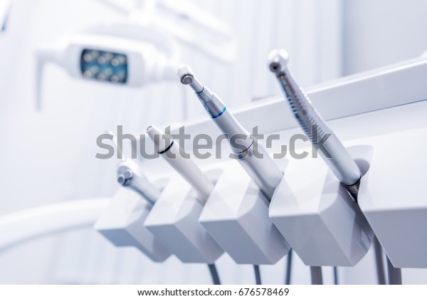 selective focus of various dental drills in\
dentist office