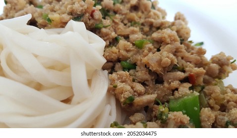 Selective Focus View Of The Classic Ginger Mince Pork Noodle Served In White Ceramic Plate. Home Kitchen, Healthy Coooking, Diet. 