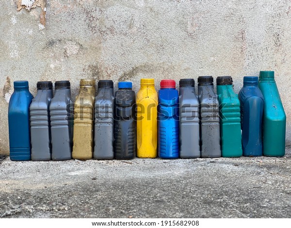 Selective focus\
Waste plastic bottles from automobile oils, Pile of motorcycle\
engine waste oil bottle, Plastic bottle  for recycle waste, Collect\
waste bottles for\
sell.