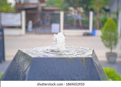 Selective Focus, Water Feature In Garden Is Chinese Belief Fountain From Pot Put On Right Front Of House Is Lucky