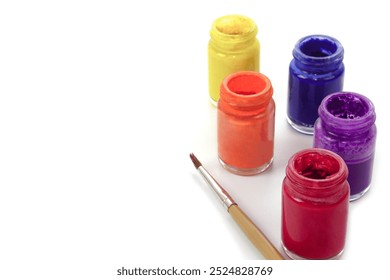 Selective focus, watercolor bottles and blur paintbrush on white background. Learning and paintings art concept. - Powered by Shutterstock