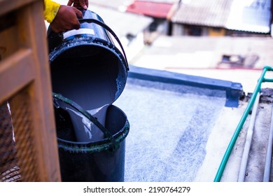 Selective Focus To Waterproofing Solution Is Being Poured Into The Tank.