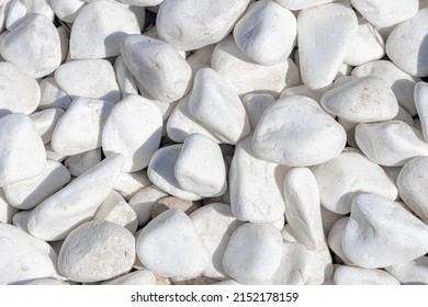 Selective focus of white pebble pattern, White grey gravel surface, Natural stone floor in the garden, Rock material texture, Abstract background.