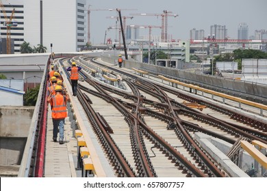 Selective Focus Of Worker Walking To Railway Or Track On Viaduct Of Sky Train For Working