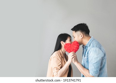 Selective focus Young Couple with red heart in love. Romantic Date Or valentine's day concept.