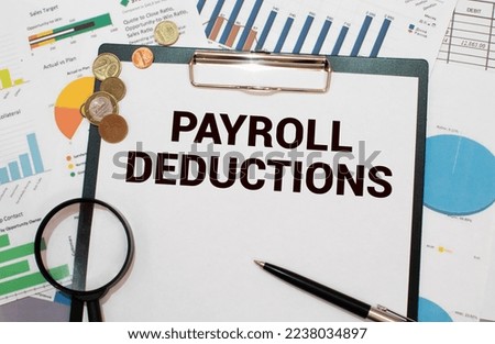 Selective focus.Calculator,pencil and banknotes with the word Payroll Deduction on world map background