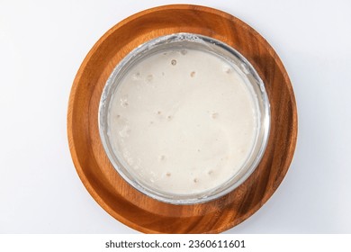 Selective focused image of fermented batter for idli and dosa in an isolated background. Idly and dosa batter in a bowl for fermentation, used to prepare the dosa and idli.