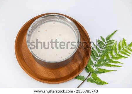 Selective focused image of fermented batter for idli and dosa in an isolated background. Idly and dosa batter in a bowl for fermentation, used to prepare the dosa and idli.

