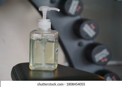 Selective Focused Sanitizer Bottle In Fitness Gym Room For Hygiene Hands, Cleanliness, Health Care To Prevent Covid-19 For Public Health Safety. Concept Covid-19.                               