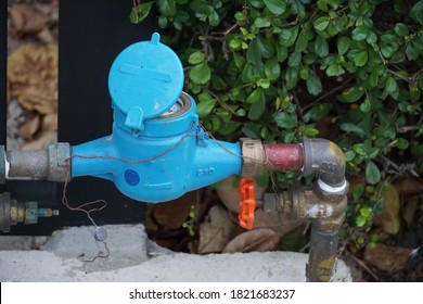 Selective Focused, Water Meter For Home Use Installed Beside Street, Connected With Water Pipeline And Main Valve. Concept Of Water Meter.                               