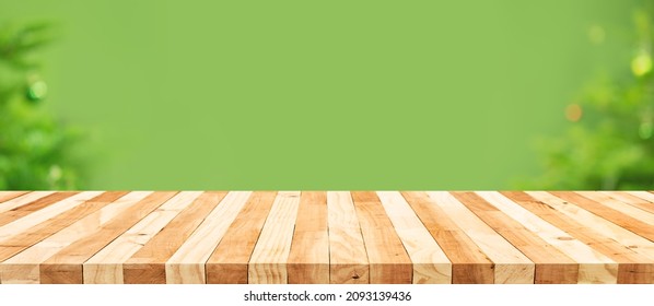 Selective Focus.Empty Wood Table Top With Blur Abstract Light Bokeh Of Christmas Tree,decoration Background.long Banner