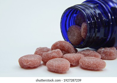 Selective Focus,gummies Vitamin C, Out Of The Bottle On White Background