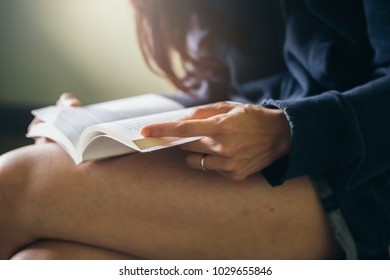 selective focus.high school or university student in casual holding open book for reading.education,study concept.vintage tone - Shutterstock ID 1029655846