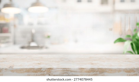 Selective focus.White rustic wood table island with cozy white wall kitchen background for design product shot	