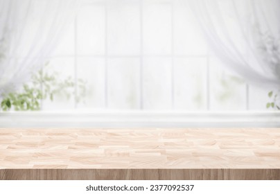 Selective focus.Wood table counter on blur curtain window in morning cozy home background.For montage product display or design key visual