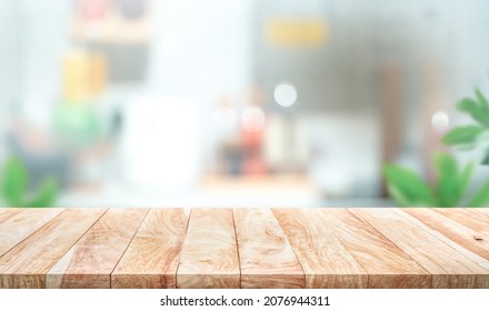 Selective Focus.Wood Table Top On Blur Kitchen Counter Background.For Montage Product Display Or Design Key Visual Layout.