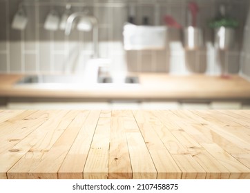 Selective Focus.Wood Table Top On Blur Kitchen Counter Background.For Montage Product Display Or Design Key Visual Layout.