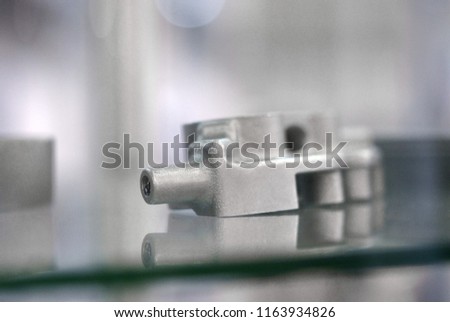 Selective Laser Melting. Object printed on metal 3d printer. Model created in laser sintering machine. DMLS, SLM, SLS technology. Concept of 4.0 industrial revolution. Progressive additive technology.