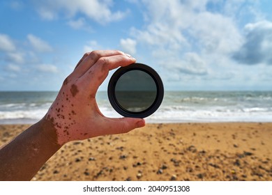 A selective of a neutral density filter in a hand of a p vitiligo