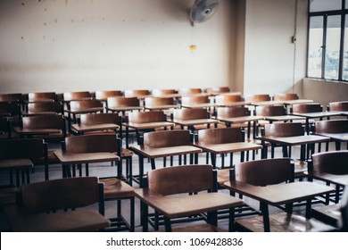 Selective Soft And Blur Focus.old Wooden Row Lecture Chairs In Dirty Classroom In Poor School.study Room Without Student.concept For Education