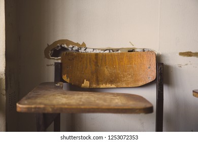 Selective Soft And Blur Focus.old Wooden Row Lecture Chairs In Dirty Classroom In Poor School.study Room Without Student.concept For Education In Third World ,donate And Charity,background Text