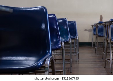 Selective Soft And Blur Focus.old Wooden Row Lecture Chairs In Dirty Classroom In Poor School.study Room Without Student.concept For Education In Third World ,donate And Charity,background Text