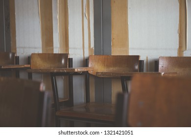 Selective Soft And Blur Focus.old Wooden Row Lecture Chairs In Dirty Classroom In Poor School.study Room Without Student.concept For Education In Third World ,donate And Charity