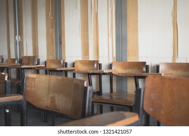 Selective Soft And Blur Focus.old Wooden Row Lecture Chairs In Dirty Classroom In Poor School.study Room Without Student.concept For Education In Third World ,donate And Charity