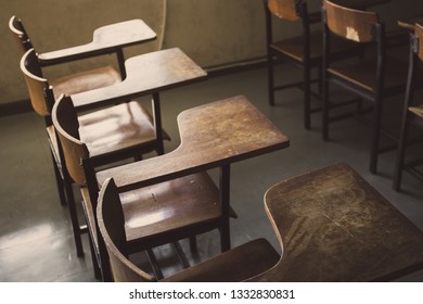 Selective Soft And Blur Focus.old Wooden Row Lecture Chairs In Dirty Classroom In Poor School.study Room Without Student.concept For Education In Third World ,donate And Charity