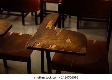 selective soft and blur focus.old wooden row lecture chairs in classroom in poor school.study room without student.concept for education in Third world