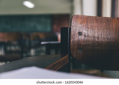 Selective Soft And Blur Focus.old Wooden Row Lecture Chairs In Dirty Classroom In Poor School.study Room Without Student.concept For Education In Third World ,donate And Charity,background Text.