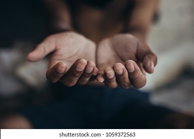 Selective soft focus. hands poor child begging you for help concept for poverty or hunger people, Human Rights,background text.