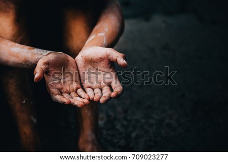 selective soft focus. hands poor child begging you for help concept for poverty or hunger people, Human Rights,background text.