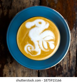 Selective and soft focus image of a glass of hot caffelatte with a beautiful foam on top, close-up shots with high angle view.