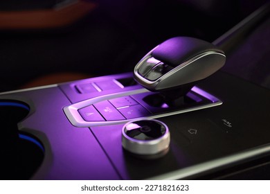 Selector automatic transmission with leather in the interior of a modern expensive car. The background is blurred. Black and brown leather car - Shutterstock ID 2271821623