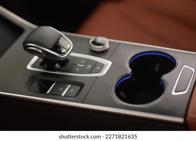 Selector automatic transmission with leather in the interior of a modern expensive car. The background is blurred. Black and brown leather car - Shutterstock ID 2271821635