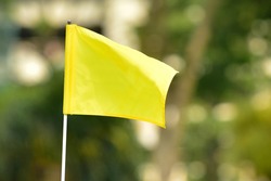 Selecttive Focus On Golf Course Flag In Malaysia. Image Contains Noise And Soft Focus Due To Low Light Condition And High Iso 