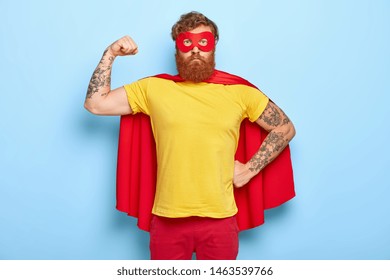 Self confident superhero shows biceps, fights evil and helps people, has great actions and achievements, pretends being heroic character, possesses supernatural power, wears mask and red cape