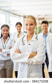 Self Confident Woman As Doctor With Team Showing Leadership