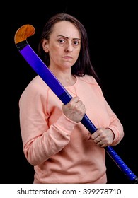 Self Defense, Woman Holding Hockey Stick On Black Background With Copy Space.