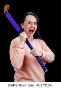 Self Defense, Woman Using A Stick As A Weapon While Screaming. Portrait On Black Background With Copy Space