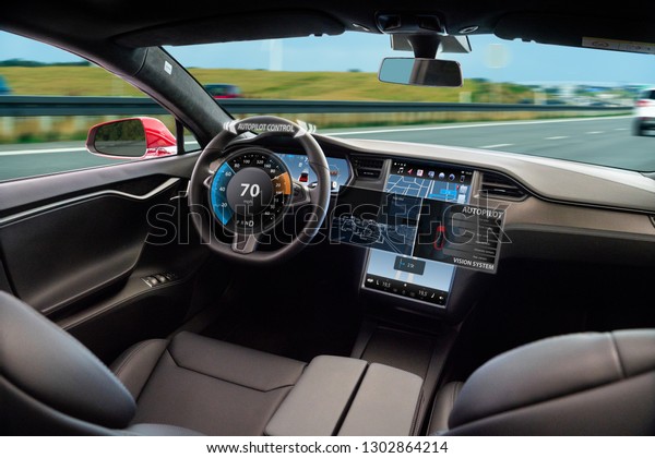 Self driving car on a road. Autonomous vehicle.\
Inside view.